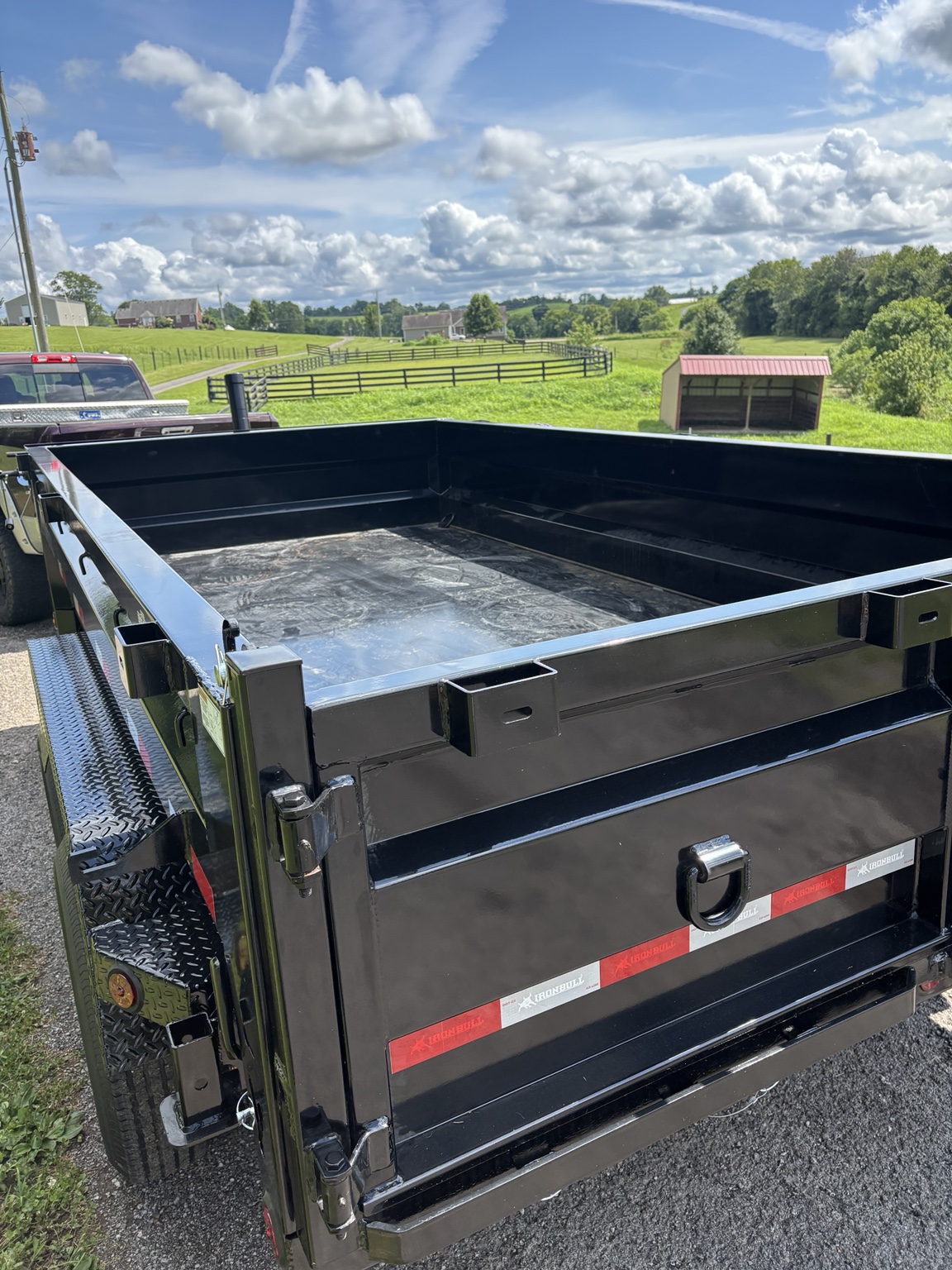 Empty black dump trailer